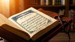 An open Quran showing Surah Al-Fatiha with Arabic calligraphy in warm amber light on a wooden surface