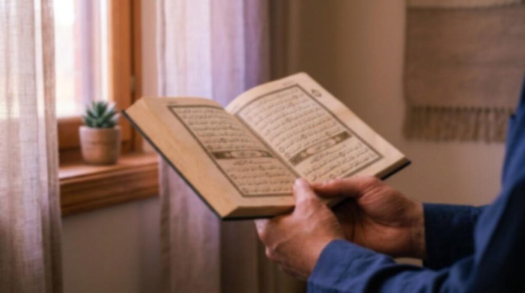 Open Quran resting on hands with soft morning light coming through a window